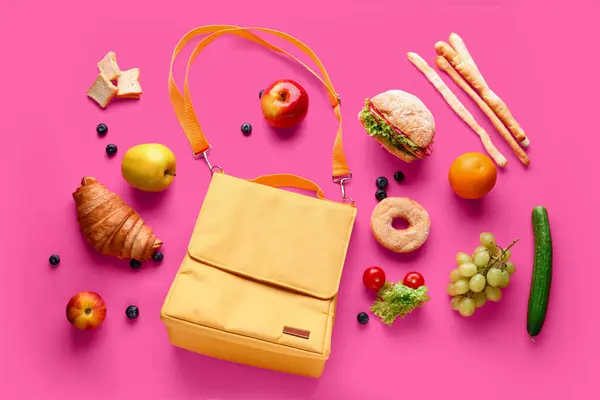 stock image Lunch box bag with different tasty food on pink background