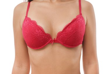 Beyaz arka planda kırmızı sutyenli genç bayan, yakın plan.