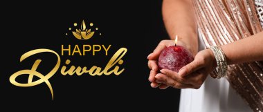 Indian woman with candle on dark background, closeup. Banner for Diwali   clipart