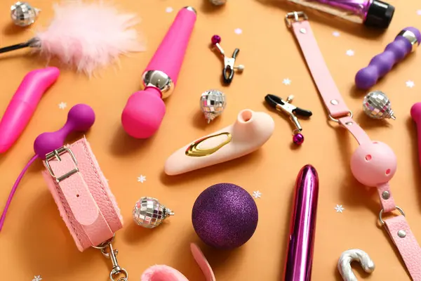 Different Sex Toys Christmas Decor Orange Background — Stock Photo, Image