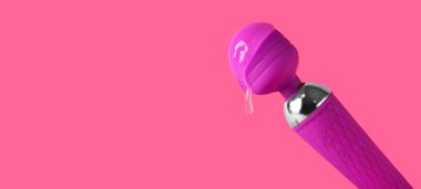 Pembe arka planda kayganlaştırıcı ve metin için alanı olan vibratör