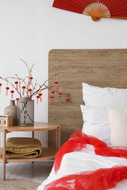 Interior of festive bedroom decorated for Chinese New Year celebration clipart