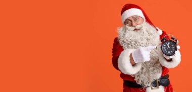 Noel Baba 'nın turuncu arka planda alarm saatini göstermesine şaşırdım.