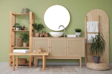 Interior of stylish bathroom with wooden cabinet, shelving unit and bench clipart