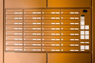 Brown mailboxes in residential building clipart