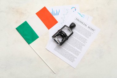 Flag of Ireland, stamp and financial documents on light background clipart