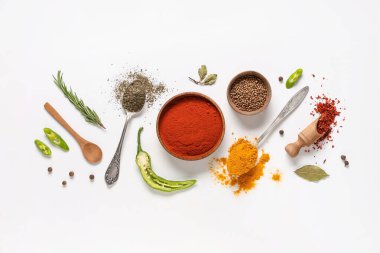 Composition with various spices on light background clipart