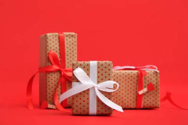 Gift boxes on red background. Valentine's Day celebration