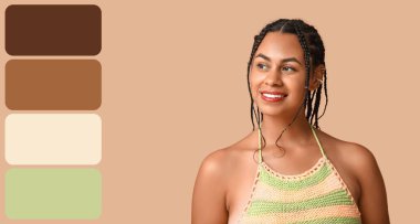 Kahverengi arka planda rastalı saçları olan güzel bir Afro-Amerikalı kadın. Farklı renk desenleri