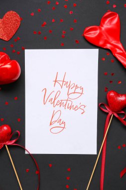 Card with text HAPPY VALENTINE'S DAY and heart shaped decor on black background