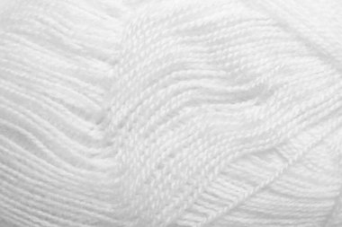 Arka plan olarak beyaz örgü ipliği dokusu, yakın plan