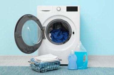 Washing machine with black mold and clothes in laundry room clipart