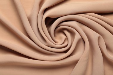 Arkaplan olarak bej buruşuk kumaş dokusu