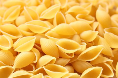 Arkaplan olarak çiğ makarna kabukları