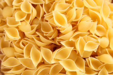 Arkaplan olarak çiğ makarna kabukları