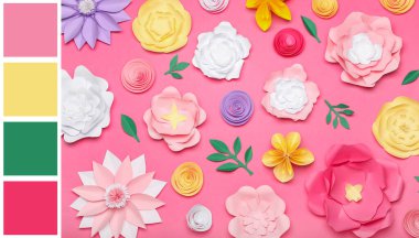 Pembe arka planda güzel kağıt çiçekler. Farklı renk desenleri