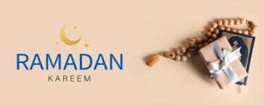 Festive banner for Ramadan with gift, Quran and prayer beads clipart