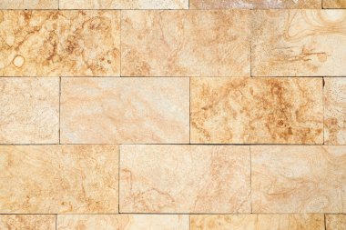 Texture of beige brick wall as background