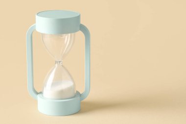 Bej arka planda kum saati. Zaman yönetimi kavramı