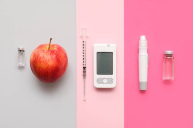 Renk arkaplanı üzerinde neşter, insülin ampülleri, elma ve şırınga bulunan modern glukometre