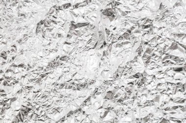 Crumpled aluminium foil as background, closeup