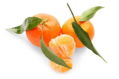 Fresh tangerines with green leaves on white background