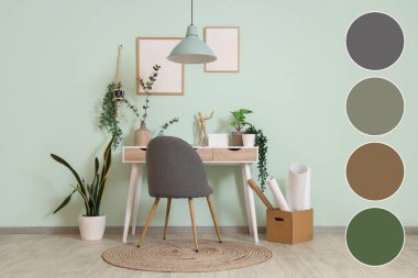 Yeşil bitkiler ve işyeriyle birlikte ofis içi. Farklı renk desenleri