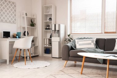 Interior of living room with modern water cooler