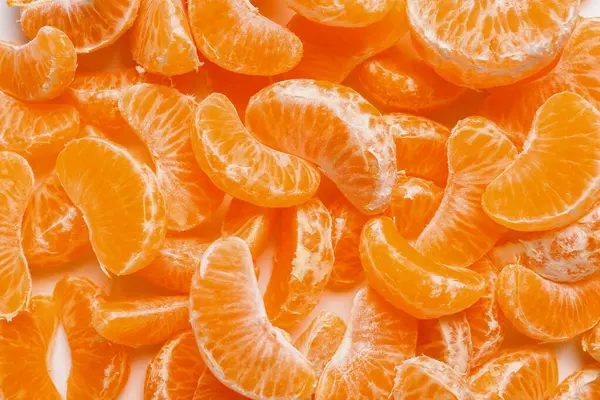 Arka plan olarak soyulmuş tatlı mandalinaların dokusu