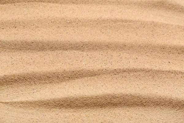 Arkaplan olarak çizgileri olan bej rengi kumsal dokusu, yakın plan