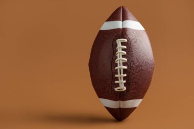 Kahverengi arkaplanda ragbi topu