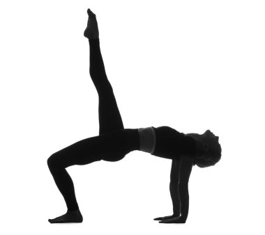Beyaz arka planda yoga yapan genç bir kadının silueti.