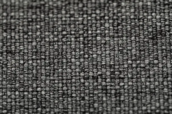 Koyu gri kumaşın dokusu, yakın plan.