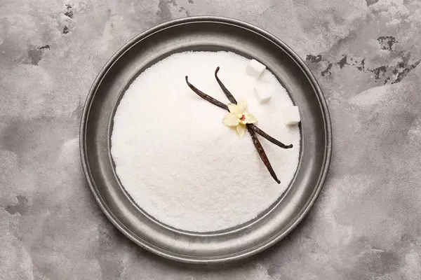 Arkaplanda tatlı vanilya şekeri tabağı, üst görünüm