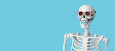 Açık mavi arkaplanda güneş gözlüğü takan komik bir insan iskeleti.