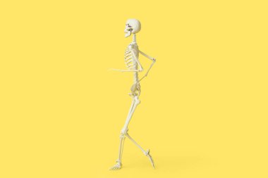 Sarı arka planda koşan korkunç insan iskeleti