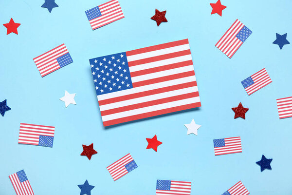 USA flags and stars on blue background. Independence Day celebration