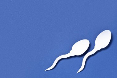Mavi arkaplanda sperm hücreleri