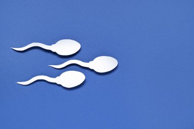 Mavi arkaplanda sperm hücreleri