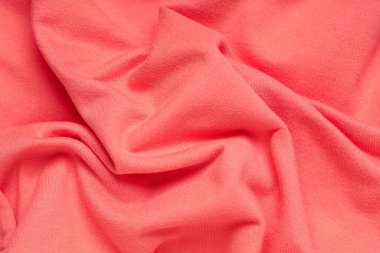 Arkaplan olarak buruşmuş mercan kumaş dokusu, yakın plan