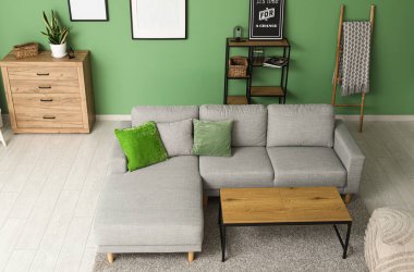 Interior of stylish living room with grey sofa and table