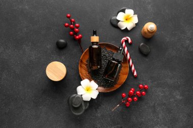 Koyu arkaplanda Noel süslemeleri olan güzel bir spa kompozisyonu