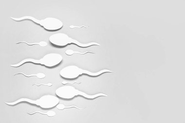 Gri arkaplanda sperm hücreleri