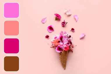 Pembe arka planda farklı güzel, yenilebilir çiçekli waffle külahı.