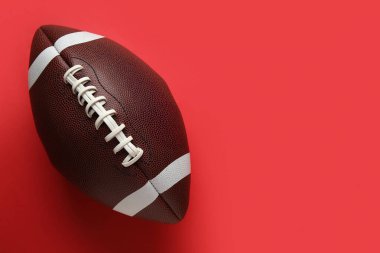Kırmızı arkaplanda rugby topu