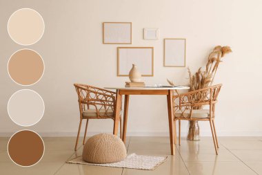 Hasır koltuklu ve beyaz duvarda boş çerçeveli bir masa. Farklı renk desenleri