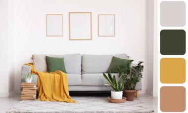 Yastıklı, ekoseli, çiçekli ve oturma odasındaki beyaz duvarda çerçeveli gri kanepe. Farklı renk desenleri