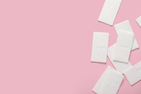 Paper napkins on pink background