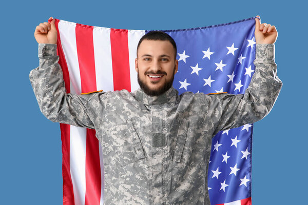 Soldier with USA flag on blue background. Labor Day celebration