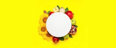 Composition for Rosh Hashanah (Jewish New Year) with blank card on yellow background